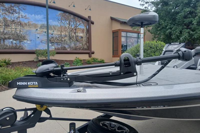 Slide: The Image of 2026 Nitro Z19 XL boat with Minn Kota Maxxum trolling motor, outdoor setting. - 1