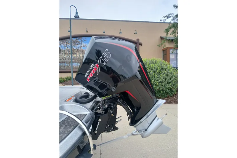 Slide: The Image of 2026 Nitro Z19 XL boat with Mercury Pro XS outboard motor, parked outdoors. - 6