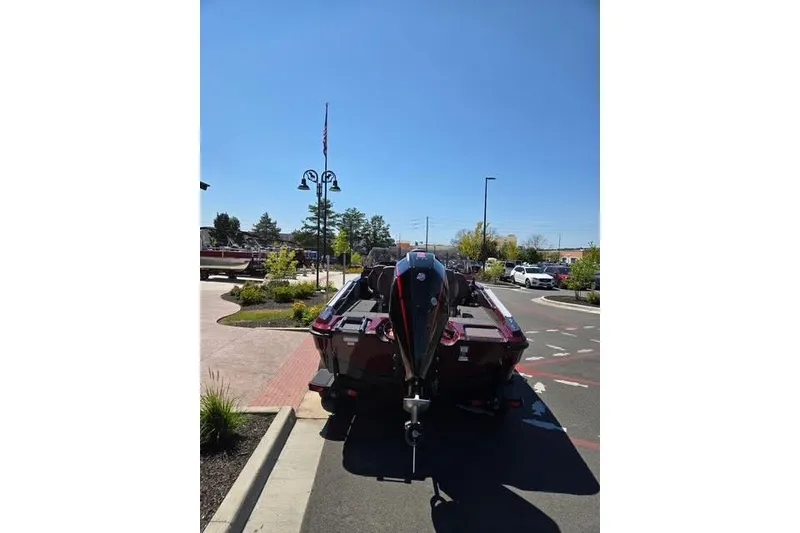Slide: The Image of 2026 Nitro ZV20 boat parked outdoors on a sunny day. - 3