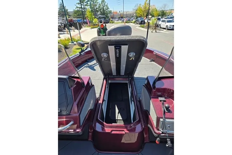 Slide: The Image of Open storage compartment on a 2026 Nitro ZV20 boat, parked outdoors. - 8