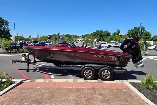Slide: The Image of 2026 Nitro ZV20 boat on trailer in parking lot, sunny day. - 1