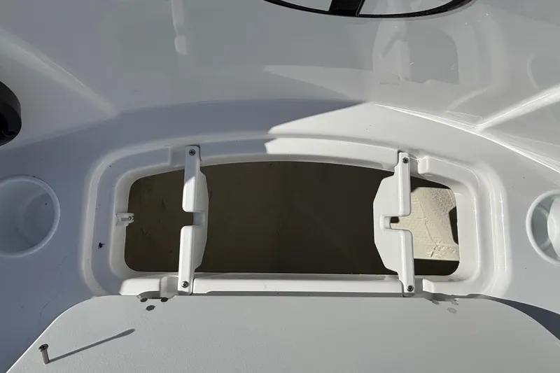 Slide: The Image of Open hatch on 2026 Tahoe T21 boat deck, showing interior compartment. - 9