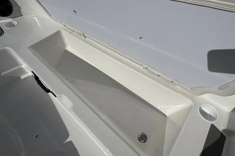 Slide: The Image of Storage compartment in 2026 Tahoe T21 boat, featuring a sleek white interior design. - 8