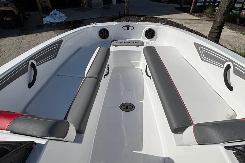 Slide: The Image of 2026 Tahoe T21 boat interior with gray and red seating, sleek design. - 5
