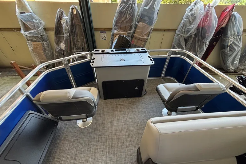 Slide: The Image of 2026 Sun Tracker Sportfish 24 XP3 boat interior with seating and control console. - 3