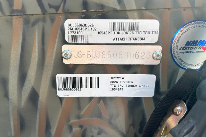 Slide: The Image of 2026 Tracker Grizzly 1654 T Sportsman boat identification labels and certification sticker. - 48