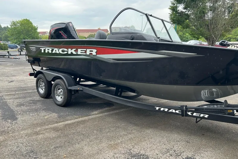 Slide: The Image of 2026 Tracker Targa V-19 Combo boat on trailer in parking lot. - 2