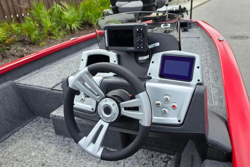 Slide: The Image of Steering console of 2026 Tracker Pro Team 190 boat with navigation system. - 14