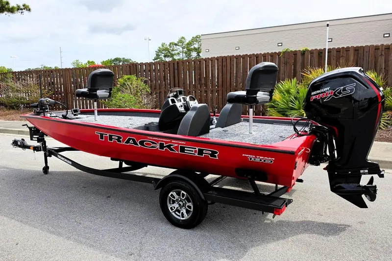Slide: The Image of 2026 Tracker Pro Team 190 boat with Mercury Pro XS engine, parked outdoors. - 11