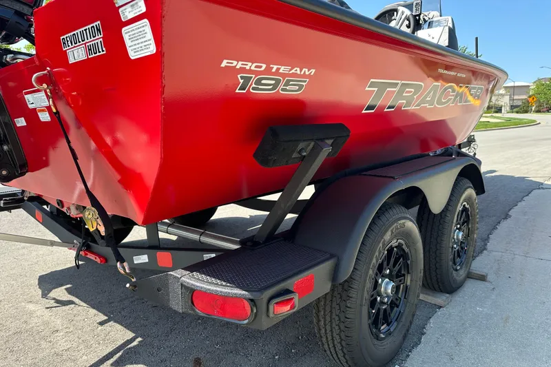Slide: The Image of Red 2026 Tracker Pro Team 195 boat on trailer, featuring Revolution Hull design. - 5