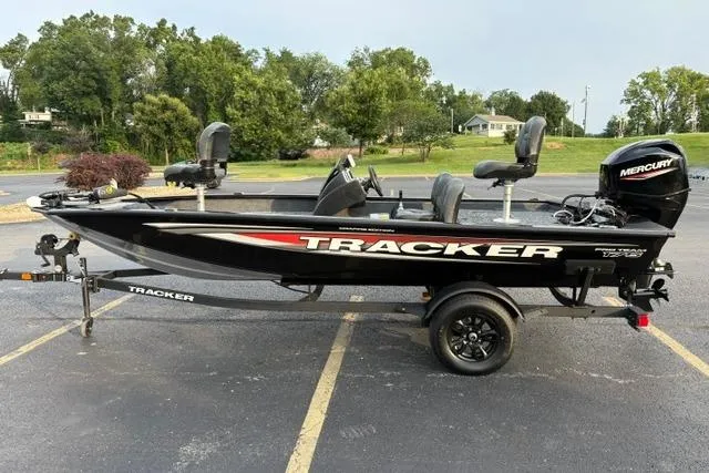 Slide: The Image of 2026 Tracker Pro Team 175 Crappie Edition boat on trailer in parking lot. - 3
