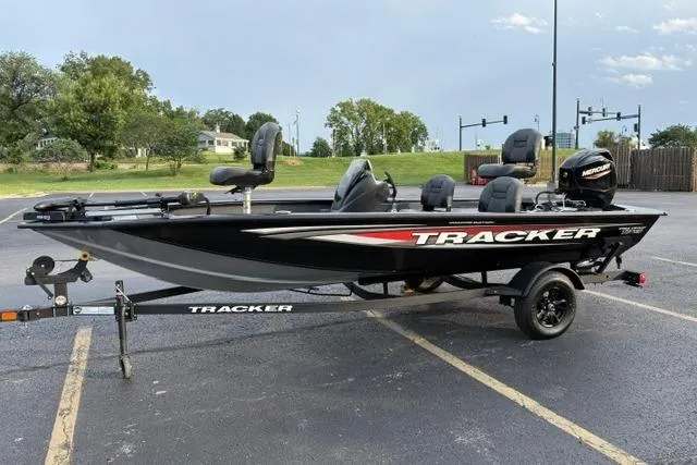 Slide: The Image of 2026 Tracker Pro Team 175 Crappie Edition boat on trailer in parking lot. - 11