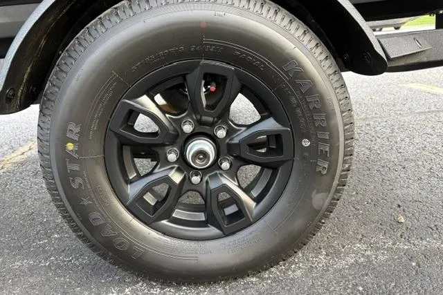 Slide: The Image of 2026 Tracker Pro Team 175 Crappie Edition trailer tire with black alloy wheel. - 27
