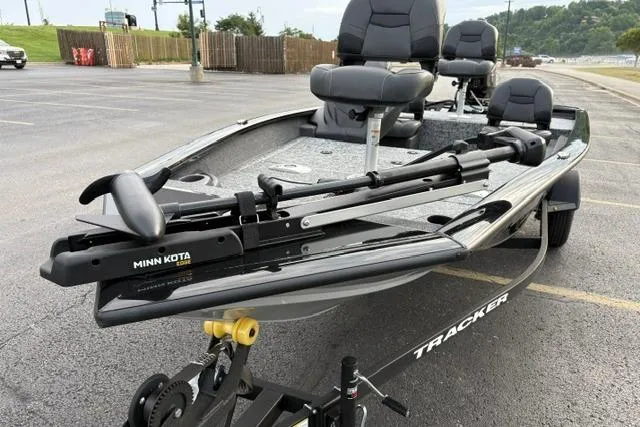 Slide: The Image of 2026 Tracker Pro Team 175 Crappie Edition boat with Minn Kota trolling motor in parking lot. - 20