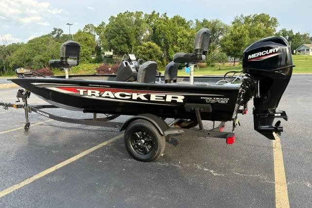 Slide: The Image of 2026 Tracker Pro Team 175 Crappie Edition boat with Mercury engine in parking lot. - 4