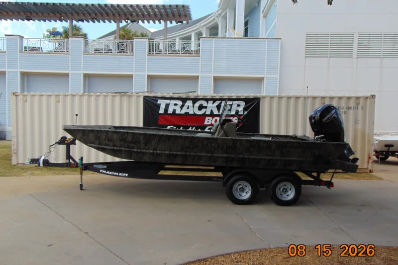 The Image of 2026 Tracker Grizzly 2072 CC boat on trailer, parked outdoors. - 0