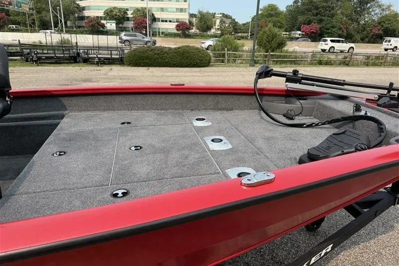 Slide: The Image of 2026 Tracker Pro Team 175 Crappie Edition boat with red trim and spacious deck. - 6
