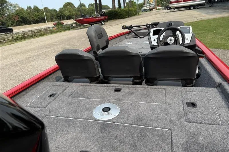 Slide: The Image of 2026 Tracker Pro Team 175 Crappie Edition boat interior with seating and steering console. - 10