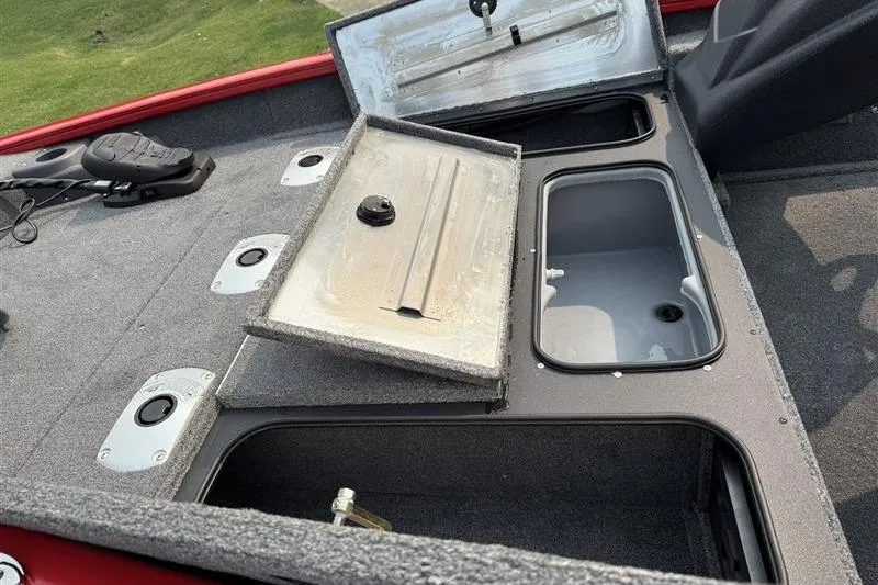 Slide: The Image of 2026 Tracker Pro Team 175 Crappie Edition boat storage compartments open on deck. - 13