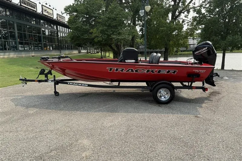 The Image of 2026 Tracker Pro Team 175 Crappie Edition boat, red, parked outdoors. - 0