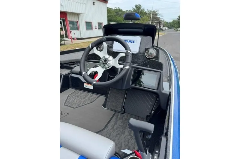 Slide: The Image of 2026 Nitro Z21 XL boat cockpit with steering wheel and dashboard controls. - 5