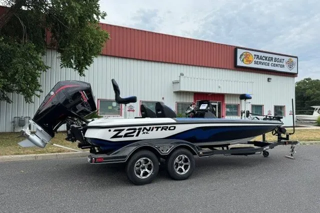 Slide: The Image of 2026 Nitro Z21 XL boat parked outside Tracker Boat Service Center. - 2