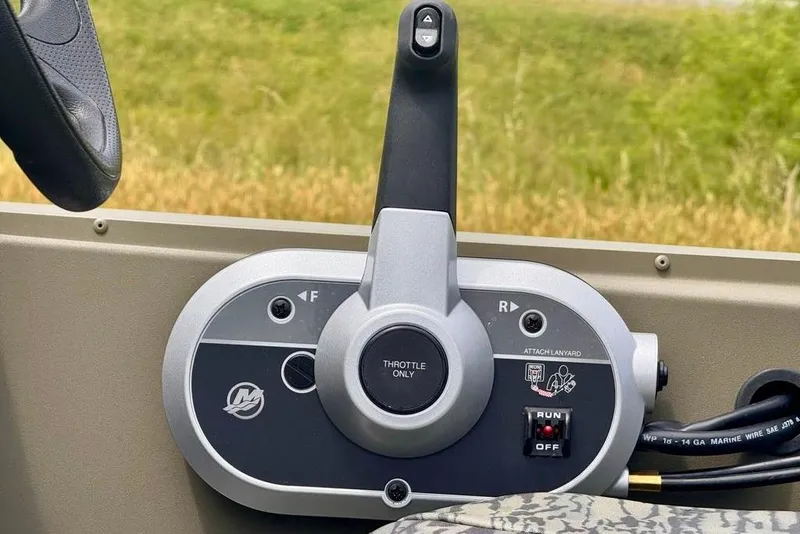 Slide: The Image of Throttle control panel of 2026 Tracker Grizzly 1754 SC boat, featuring forward and reverse options. - 8