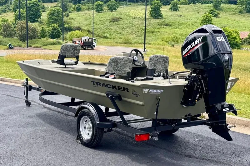 Slide: The Image of 2026 Tracker Grizzly 1754 SC boat with Mercury 60 engine on trailer. - 6