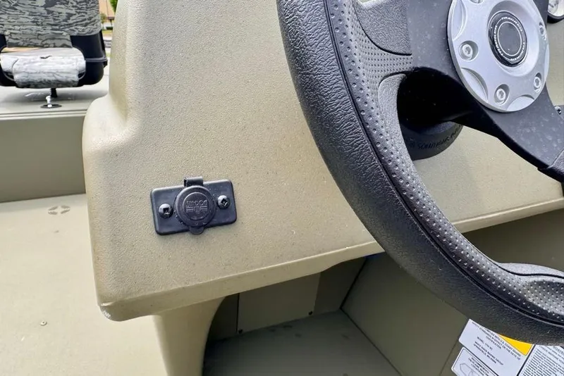 Slide: The Image of Steering wheel and console of 2026 Tracker Grizzly 1754 SC boat. - 7