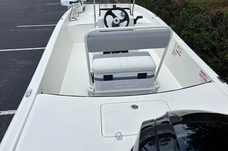 Slide: The Image of 2026 Mako Pro Skiff 17 CC boat interior with steering console and seating. - 8