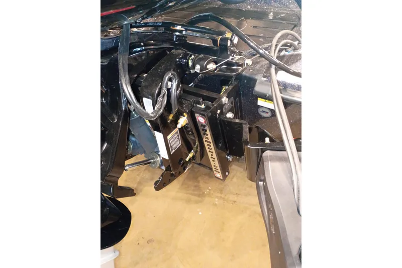 Slide: The Image of 2026 Ranger Z519R Cup-Equipped boat engine compartment with hydraulic components and wiring. - 7
