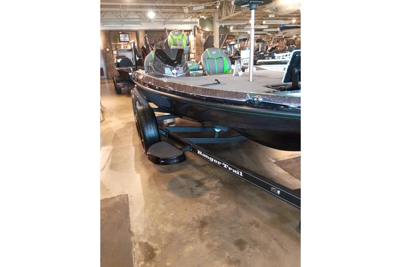 Slide: The Image of 2026 Ranger Z519R Cup-Equipped boat on trailer in showroom setting. - 2