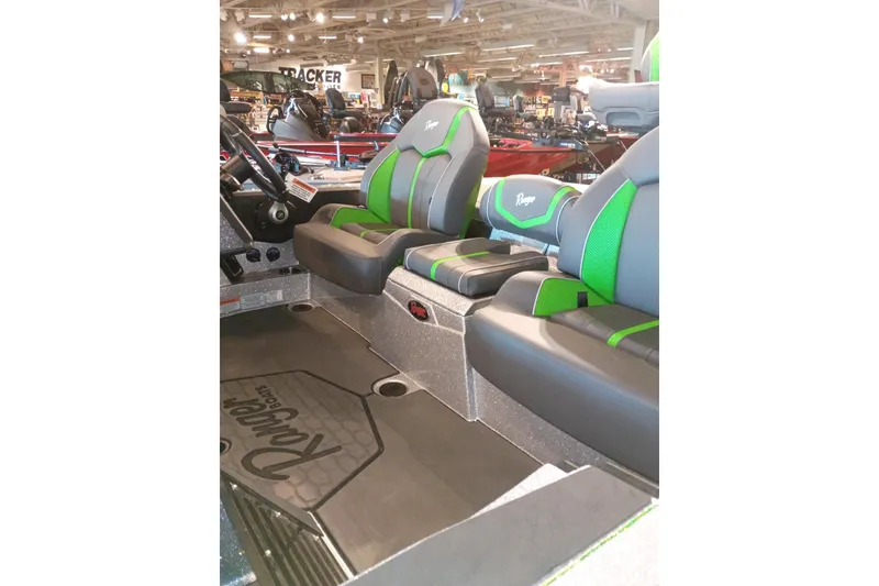 Slide: The Image of 2026 Ranger Z519R Cup-Equipped boat interior with green-accented seats at a showroom. - 10