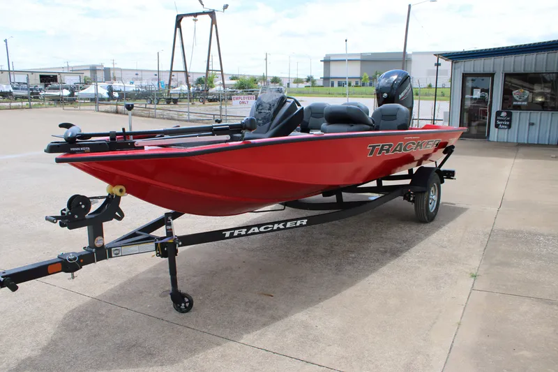 Slide: The Image of 2026 Tracker Pro Team 175 Crappie Edition boat on trailer, parked outdoors. - 3