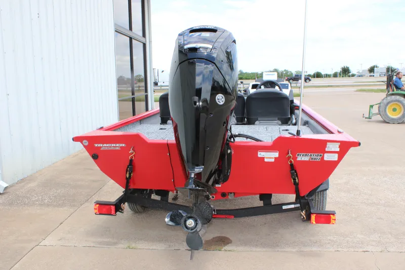 Slide: The Image of 2026 Tracker Pro Team 175 Crappie Edition boat, red exterior, parked outdoors. - 4