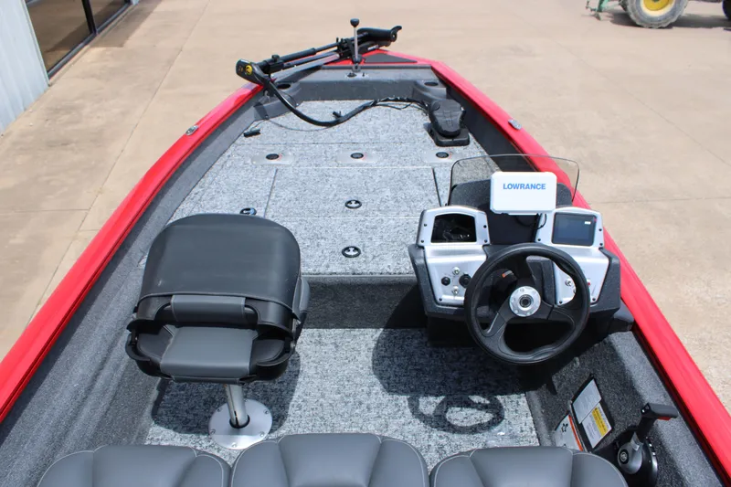 Slide: The Image of 2026 Tracker Pro Team 175 Crappie Edition boat interior with steering wheel and Lowrance electronics. - 5