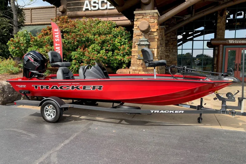 The Image of 2026 Tracker Pro Team 190 boat in vibrant red, displayed outdoors on a trailer. - 0