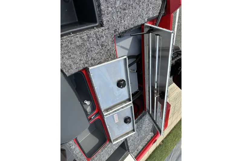 Slide: The Image of 2026 Tracker Pro Team 195 boat interior with open storage compartments. - 16