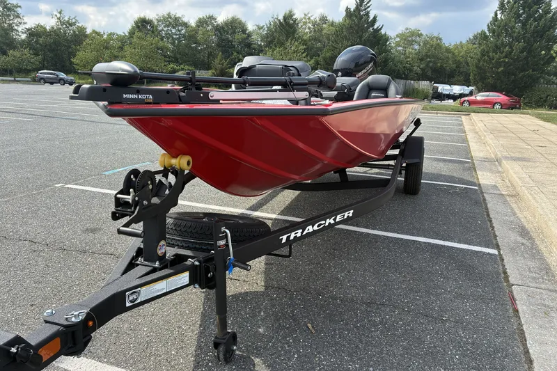 The Image of 2026 Tracker Pro Team 195 boat on trailer in parking lot. - 0