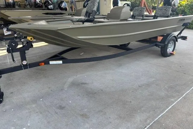 The Image of 2026 Tracker Grizzly 1754 SC boat on trailer, parked outdoors. - 0