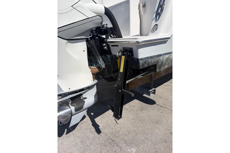 Slide: The Image of 2021 Contender boat with outboard motor and hydraulic lift system. - 14