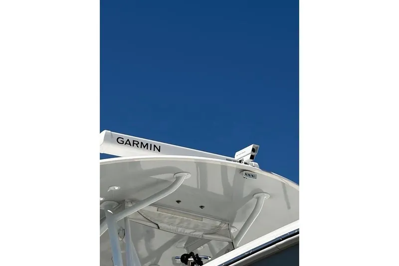 Slide: The Image of Contender 2021 boat with Garmin radar against clear blue sky. - 15