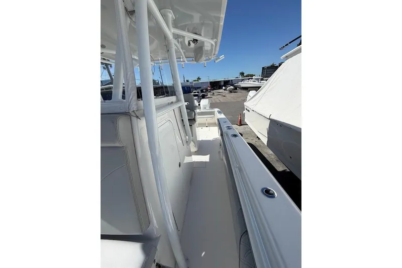 Slide: The Image of 2021 Contender boat interior with sleek white design and spacious deck. - 19