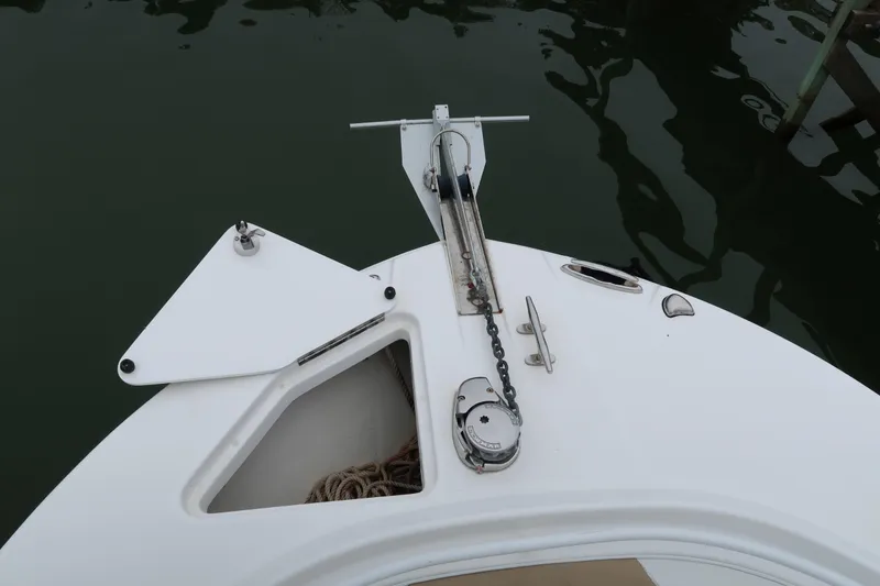 Slide: The Image of Bow of 2017 Edgewater 245CC boat with anchor chain and storage compartment. - 16
