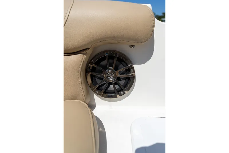 Slide: The Image of Speaker and beige upholstery on 2020 NauticStar 203 SC boat. - 11
