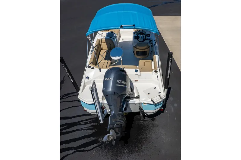 Slide: The Image of 2020 NauticStar 203 SC boat with blue canopy and Yamaha outboard motor. - 22