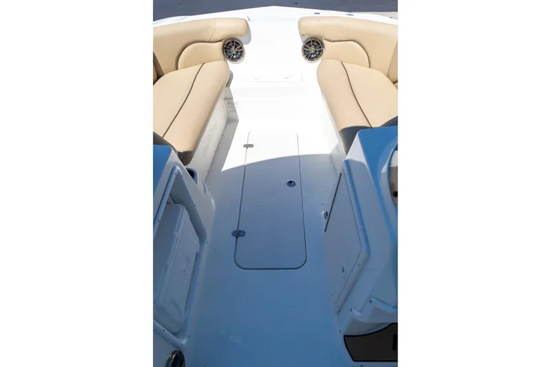 Slide: The Image of Interior view of 2020 NauticStar 203 SC boat with beige seating and storage compartments. - 27