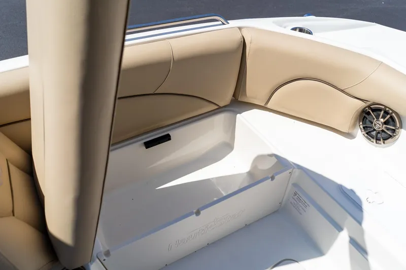 Slide: The Image of Interior seating of 2020 NauticStar 203 SC boat with beige upholstery and speaker. - 29