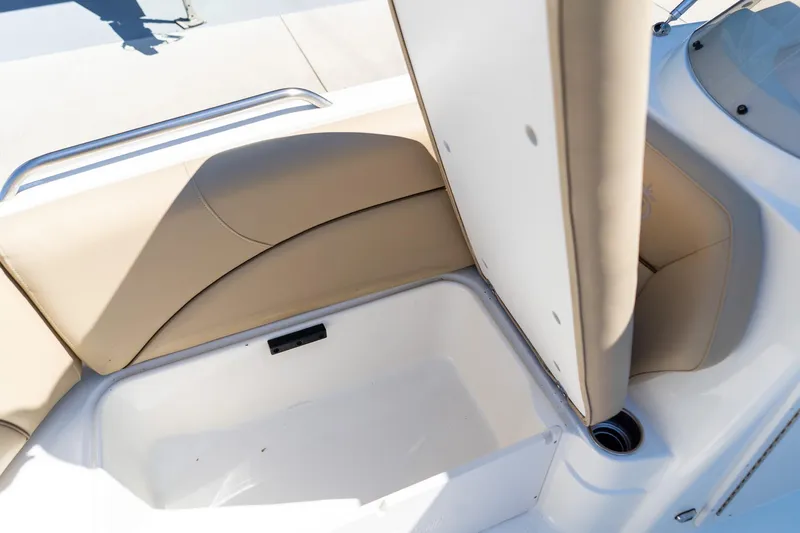 Slide: The Image of 2020 NauticStar 203 SC boat seat with storage compartment open. - 30