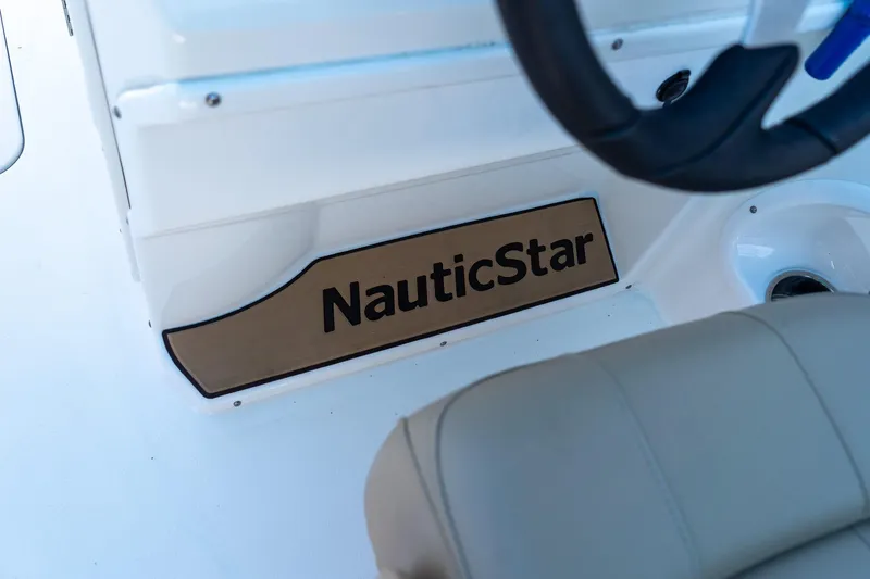 Slide: The Image of 2020 NauticStar 203 SC boat interior with logo and steering wheel. - 34